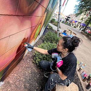 Pearl Fu Plaza Mural (Untitled) by Wingchow (Christina Wing Chow)  Image: Wingchow at work on the untitled mural.