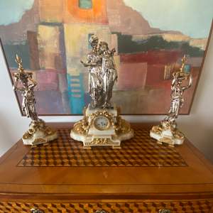 The three-piece clock garniture centered around the large silvered bronze figural group after the original by Albert-Ernest Carrier-Belleuse,, Image 1.