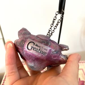 Cheshire Cat Ornament by Marie Young  Image: Marie Young Creative maker's stamp on the back