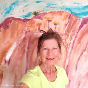The Mountains Remain Silent as the Wind Howls by Mary Rush  Image: Mary Rush in front of her painting, "The Mountains Remain Silent as the Wind Howls"