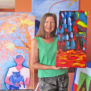 Soul's Cavern by Mary Rush  Image: Me, Mary Rush, with Soul's Cavern and other paintings.