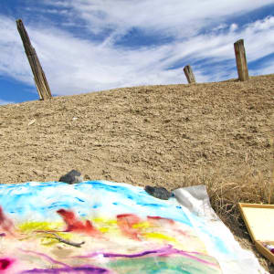 Sand and Salt by Mary Rush  Image: Painting on location. Wood sticks protrude out of the salt mound.