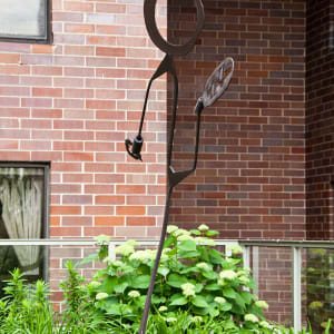 Stick figure in rusted metal by Nancy Metz White 
