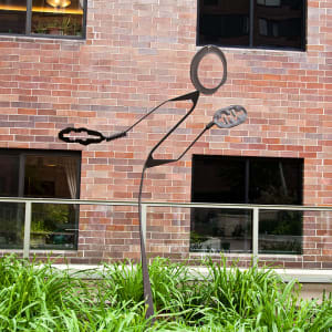Stick figure in rusted metal by Nancy Metz White