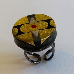 round gold and black ring by Paul Guillemette