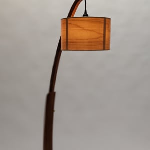 Snowdrop Floor Lamp by Tim Carney  Image: Tim's Snowdrop arched floor lamps with handmade-maple-veneer shades sold out almost as soon as we opened the CONTEMPORARY WOOD exhibit. We have gotten requests for special orders of these lamps, so Tim decided to make several more. These two are made of Sapele or Cherry. He will also entertain the notion of making one or more of these lamps in walnut, birch or maple. All will have his gorgeous maple-veneer lamp shade, an LED dimmable bulb and of course, the graceful form exactly like these. 