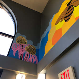 2025 Honeybee Mural by Frances Byrd  Image: Echinacea Flowers, approximately 3x4 feet
Portion of large honeycomb mural on adjoining wall
Located approximately 10 feet above ground level