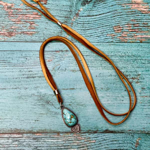 "Raindrop Shell Stamped Pendant" - Kingman Turquoise set in Sterling Silver, on Deerskin Leather Lace by Shasta Brooks  Image: All Art © Shasta Brooks Studio LLC
