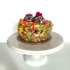 Three Chocolates on a Cake by Shiri Phillips 