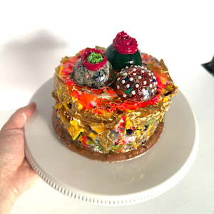 Three Chocolates on a Cake by Shiri Phillips 