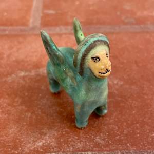 Blue Gem, a flying  teenie lion for truth and justice by Nell Eakin 