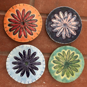 Daisy coasters, lots of colors by Nell Eakin 