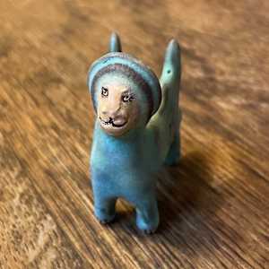 Blue Gem, a flying  teenie lion for truth and justice by Nell Eakin 