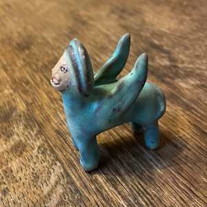 Blue Gem, a flying  teenie lion for truth and justice by Nell Eakin 