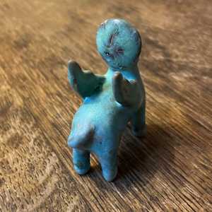Blue Gem, a flying  teenie lion for truth and justice by Nell Eakin 