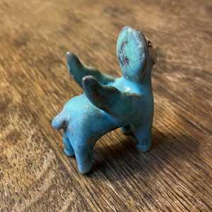 Blue Gem, a flying  teenie lion for truth and justice by Nell Eakin 