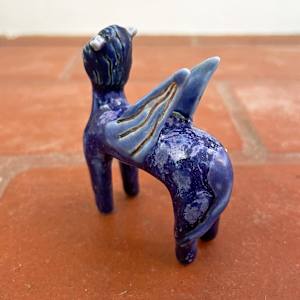 Eye on the Flyen Lion, in purple by Nell Eakin 