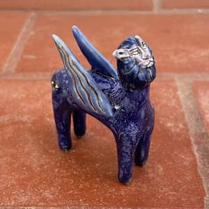 Eye on the Flyen Lion, in purple by Nell Eakin 