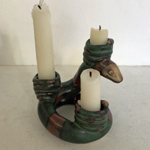 Ela, a mama snake with 3 baby snake candle holders,  is a Snake-a-labra. by Nell Eakin 