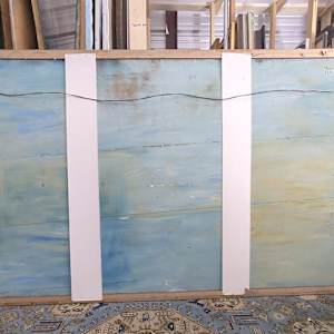 4 - Stations of the Cross Series - Jesus Meets Mary His Mother by Miriam McClung  Image: Back of work. Board has been painted blue at one point. Paper is removed to allow airflow. Two white strips were to support paper back.