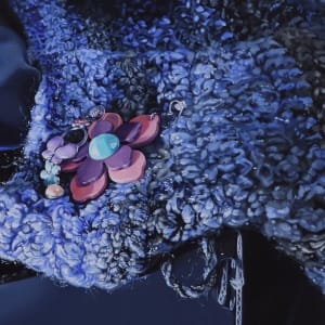 Still Blue Sparkle by Sonia C. C. Colón  Image: Detail of earrings and scarf area in the center foreground.