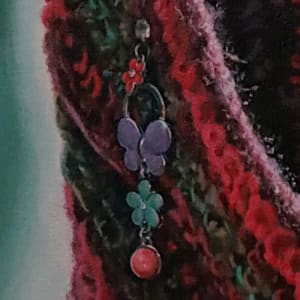 Solitary Colors by Sonia C. C. Colón  Image: Close-up of earring and scarf detail.