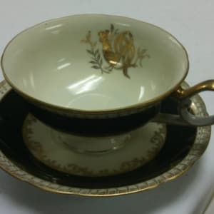 Cup and Saucer with Black and Gold Design by Del-Mar