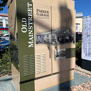 Utility Wrap - Then and Now History Wrap (NW Corner of Pikes Peak Dr. and Mainstreet) 