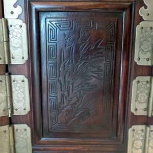 Korean Glass Front Amoire Chest in Beautiful Dark Wood with Carved Wood Motif and Bats and Cherry Blossom Metal Embellishments by Tristina Dietz Elmes 