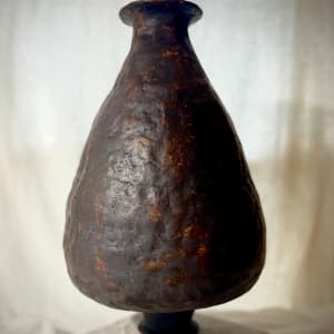 Gilded Matriarch by Jennifer K Brown  Image: Burnished ceramic vessel exhibited in Paris, Design Week 2023. Hand-built using traditional methods, bisque-fired, burnished with manganese dioxide, and fired again.
