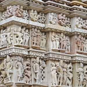 Scenes of amorous couples and celestials at Parshvanatha temple by Khajuraho Temple complex, Madhya Pradesh