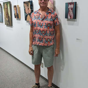 Nude Woman with Raised Arms by Richard Michael Delaney  Image: The artist standing beside his painting on display. 