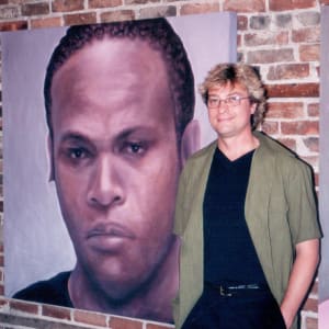 Fugitive Trevor Glenroy Prudence by Richard Michael Delaney  Image: The artist with the painting installed for a solo exhibition. 