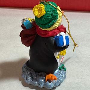 Penguin with package by David  H. L. Blackman, Ph. D. 