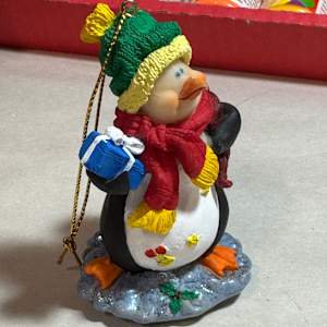 Penguin with package by David  H. L. Blackman, Ph. D. 