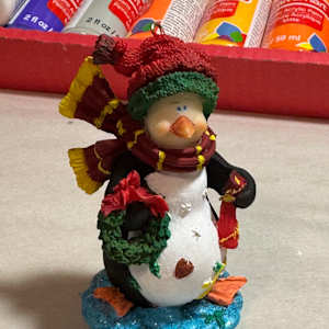 Penguin with package by David  H. L. Blackman, Ph. D. 