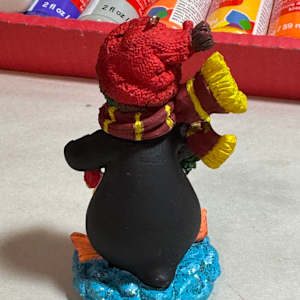 Penguin with package by David  H. L. Blackman, Ph. D. 