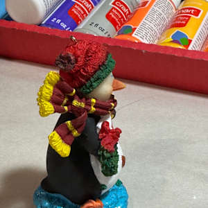 Penguin with package by David  H. L. Blackman, Ph. D. 