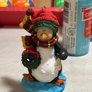 Penguin with Wreath by David  H. L. Blackman, Ph. D. 