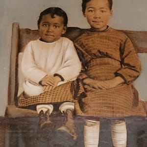 Smiling children on a bench