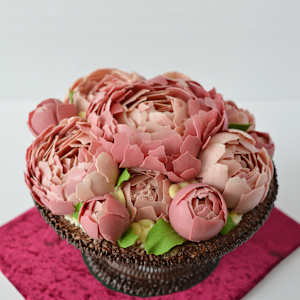 Chocolate artwork "Peony flowers" by Gerhard Petzl  Image: Peony flowers arrangement on baroque stand, 100% chocolate, on red velvet board
