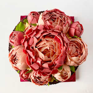 Chocolate artwork "Peony flowers" by Gerhard Petzl  Image: Peony flowers arrangement on baroque stand, 100% chocolate, with iPhone 