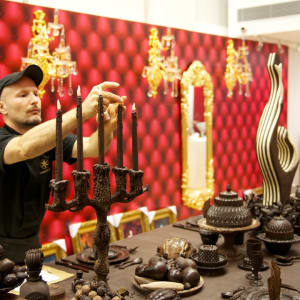 The Royal Feast baroque table by Gerhard Petzl  Image: Adding the (chocolate) flames to the candles.