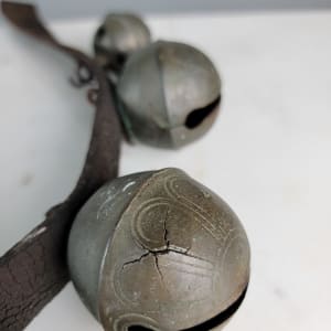 Antique Petal Sleigh Bells  Image: Cracks in bells.