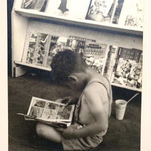 "Child Reading Comics" by Margaret Daughtry