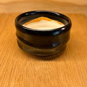 Sake Cup (Guinomi), Black with white interior by Marianne Wilson Studio, Image 1.