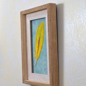 Yellow Parrot Feather by Janet Herman  Image: Side view of Yellow Parrot Feather