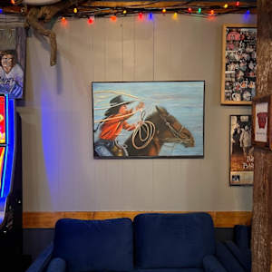 Katie rodeo roping by Hanna Bordewijk  Image: Katie's painting displayed in the historic Queens Hotel